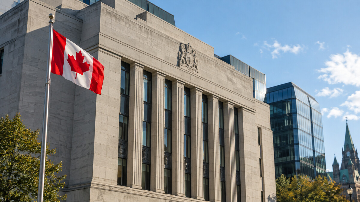 Modern Canadian central-bank style building facade with a Canadian flag in clear daylight